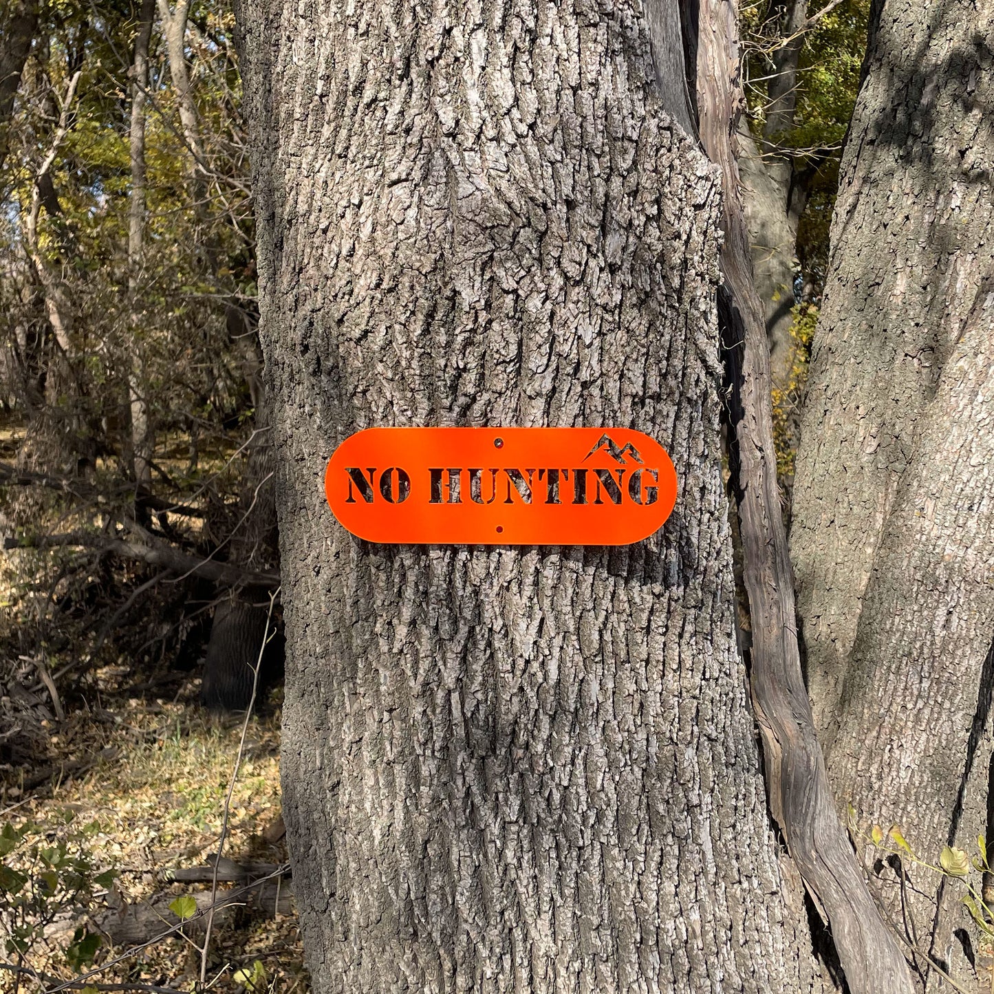 "No Hunting" sign mounted to a tree by Rock River Outdoors